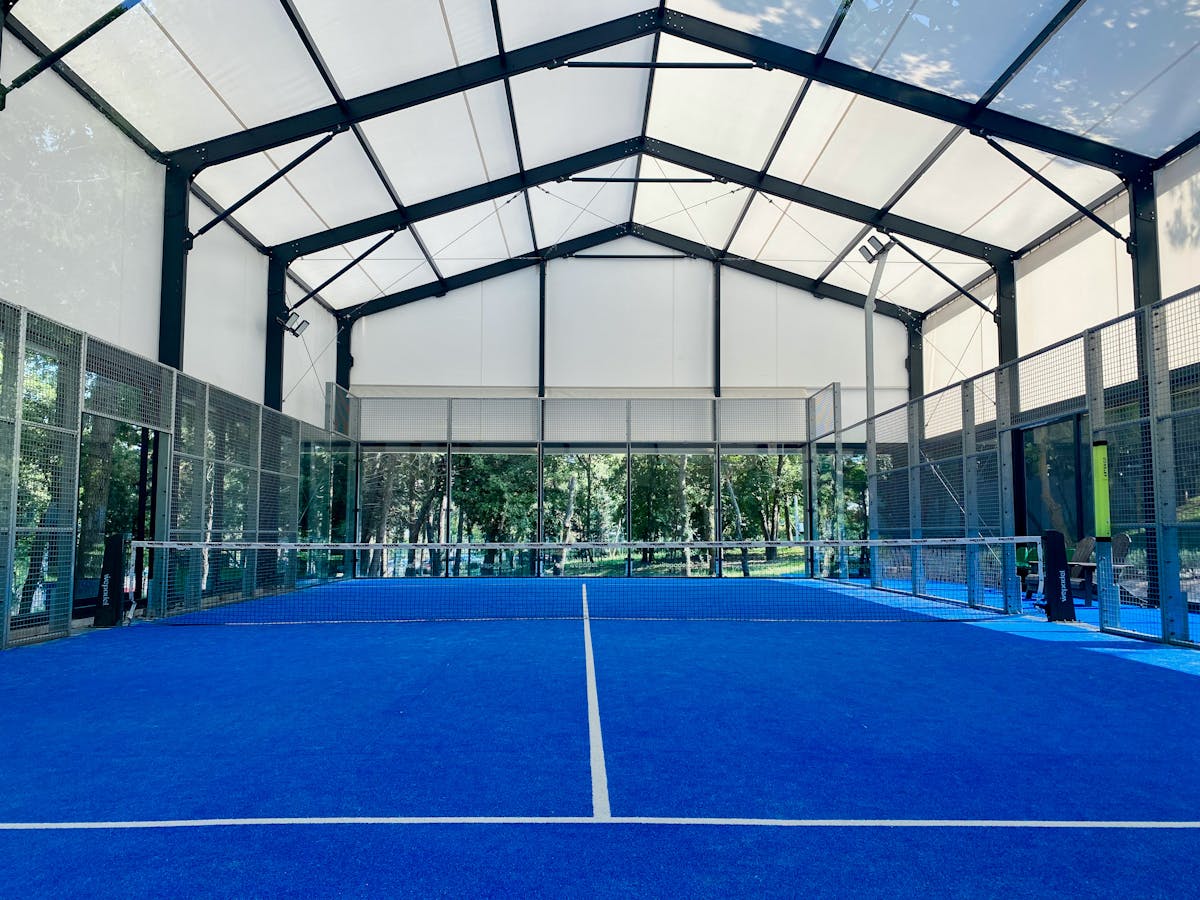 Padel Racket Protectors: Are They Worth It? Complete Guide 2026 2 Padel court showing glass walls where racket impacts commonly occur