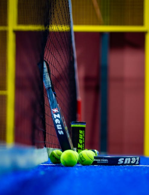 This Week in Padel: Premier Padel Kicks Off with Historic Wins, Calendar Shifts, and Global Expansion 3 Colorful padel court with racket and balls highlights the sport's dynamic nature and vibrant setting.