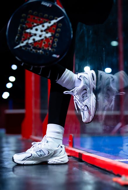 This Week in Padel: Premier Padel Kicks Off with Historic Wins, Calendar Shifts, and Global Expansion 4 Close-up of person with padel racket and sneakers on a vibrant court.