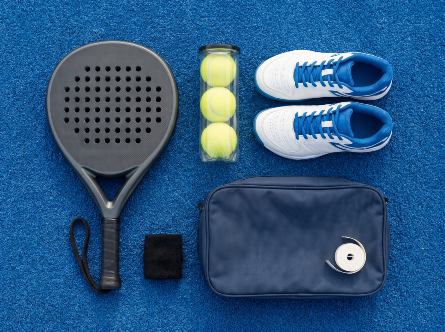 Complete padel kit with racket, balls, shoes, bag and accessories on court